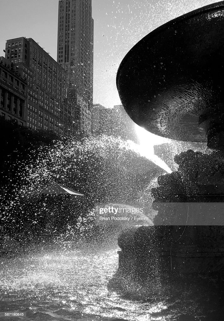Fountain Against Buildings